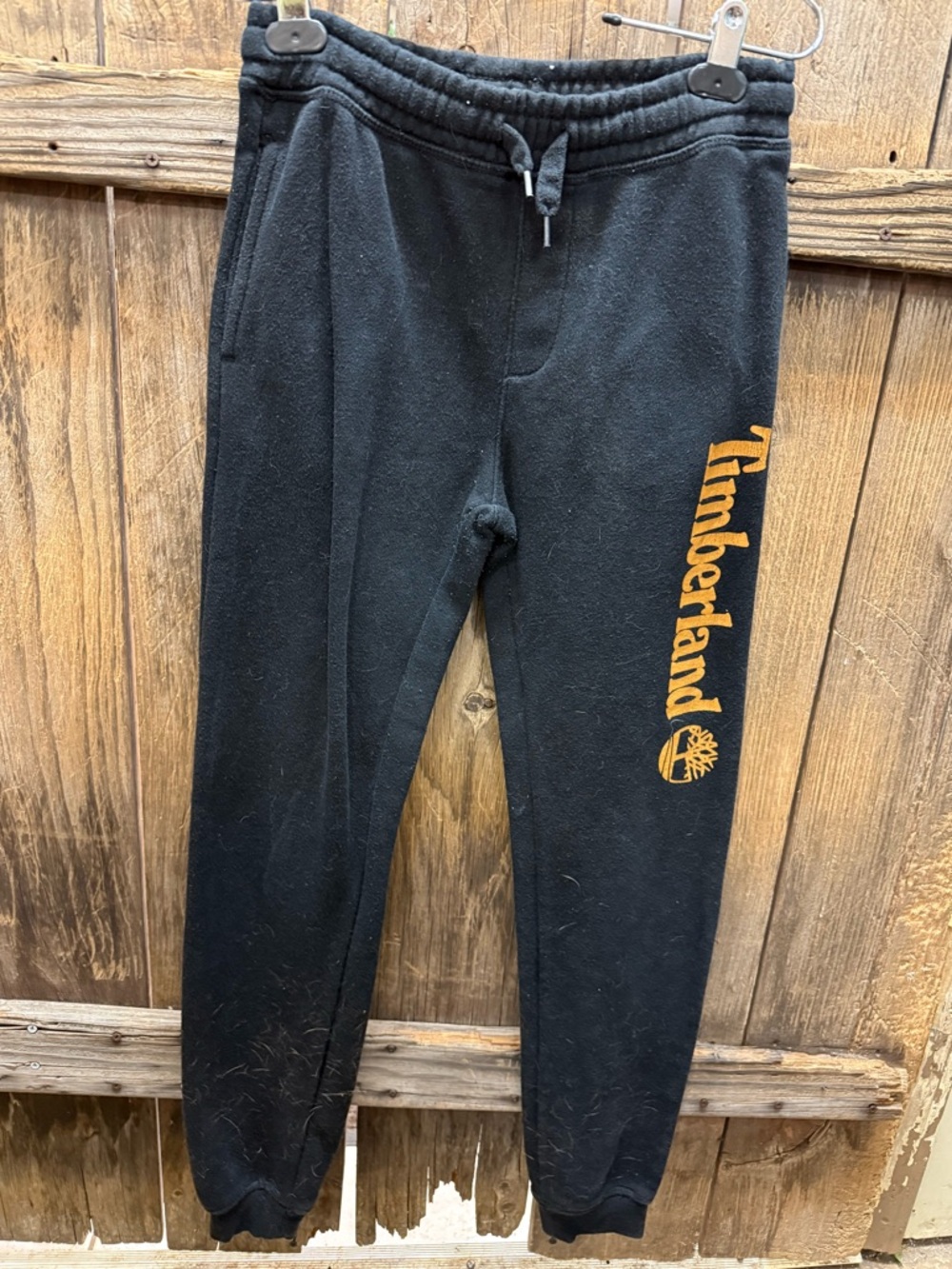 Timberland Black Garment Tag with Yellow Logo Accent
